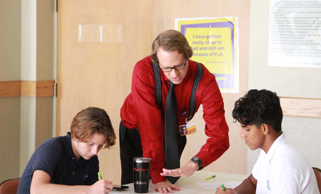 Teacher from Adventist Health University instructing Forest Lake Academy students